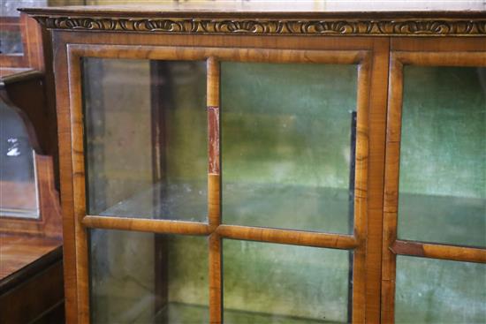 An early 20th century George I style parcel gilt walnut display cabinet, W.148cm, D.44cm, H.148cm